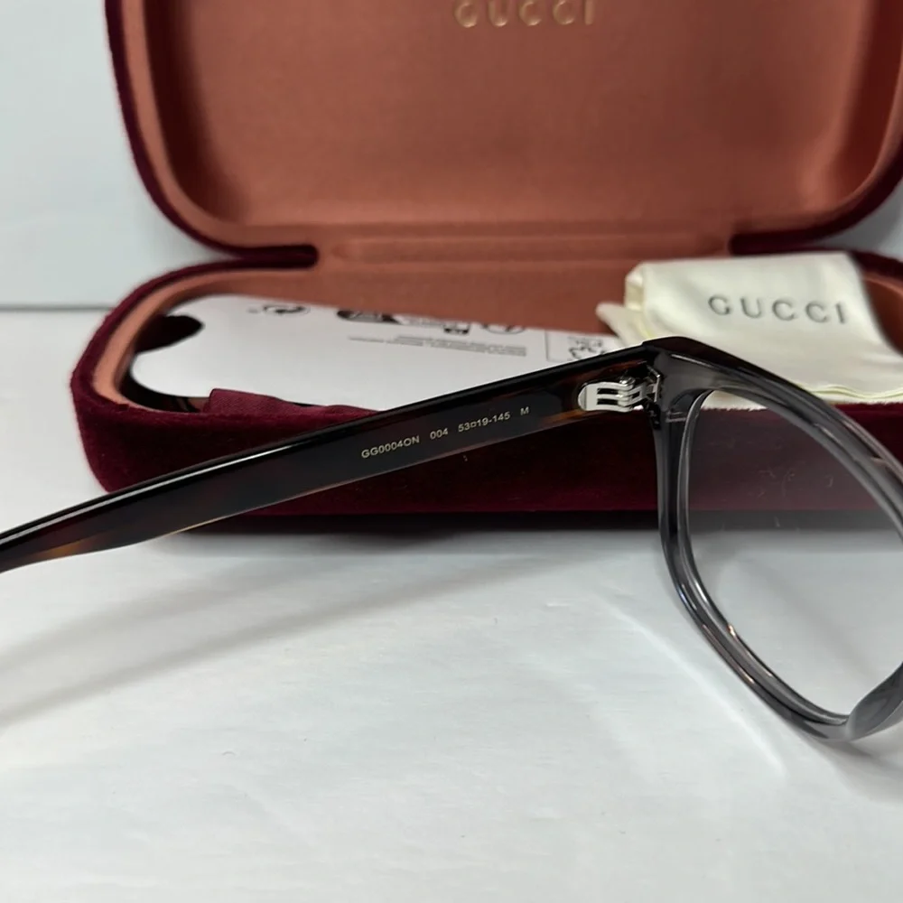 New- Auth - Gucci's GG0004ON soft lines across frames front.Iconic web effect…